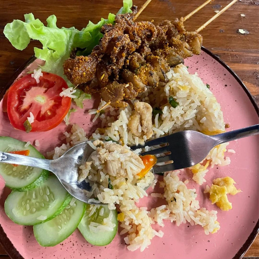 Should rice be eaten with a spoon or fork? 
